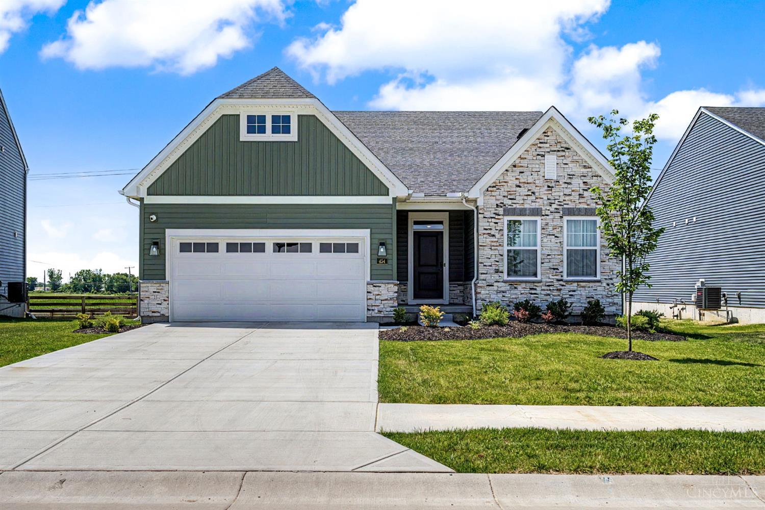 2025 built luxury home at 454 Red Maple Ln Wilmington Ohio listed by Bryan Vance of Vance Team Realtors featuring stone fireplace quartz countertops and spa like primary suite